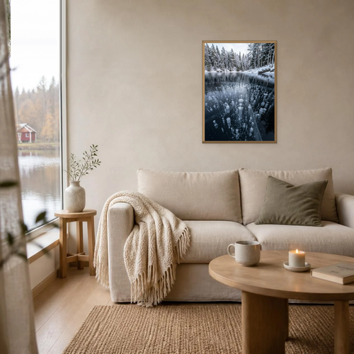 Air Bubbles in the Frozen Lake poster in a light oak frame above a linen sofa