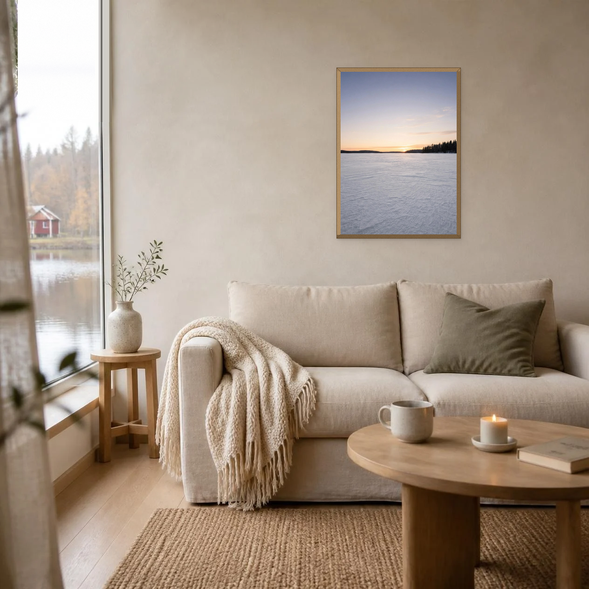 Sunrise Over the Frozen Lake poster in a light oak frame above a linen sofa