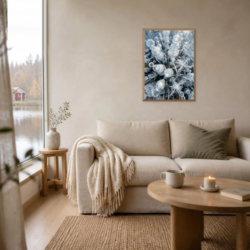 Air Bubbles in the Ice poster in a light oak frame above a linen sofa
