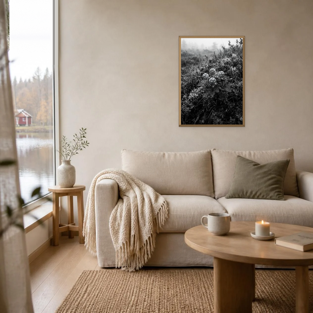 Wild Cloudberries poster in a light oak frame above a linen sofa