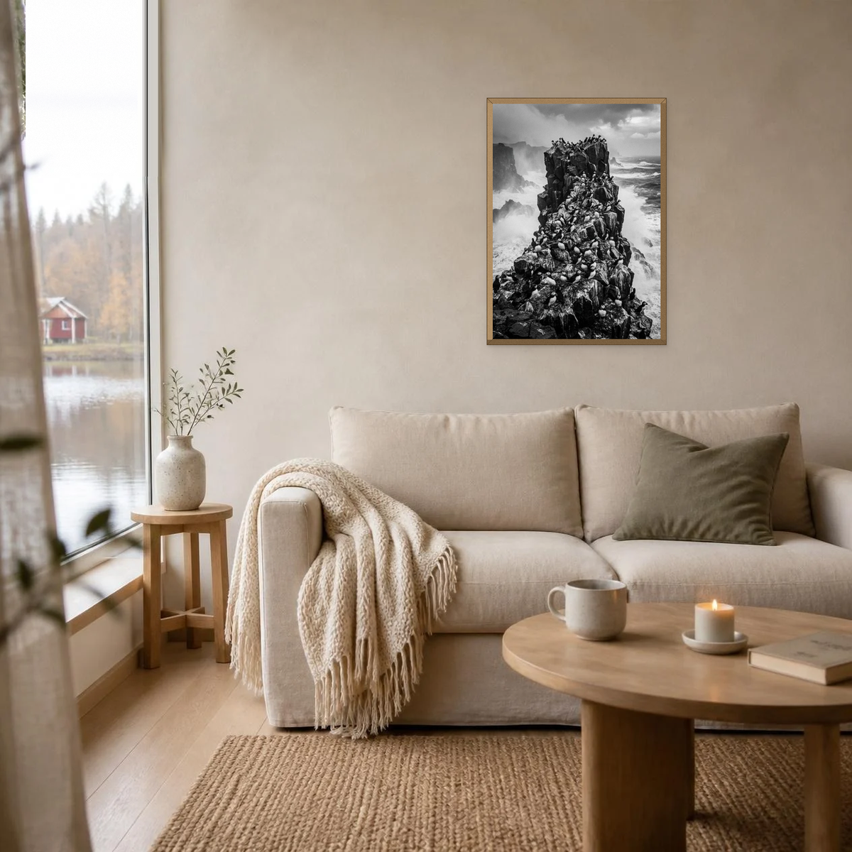 Puffins on the Sea Stack poster in a light oak frame above a linen sofa