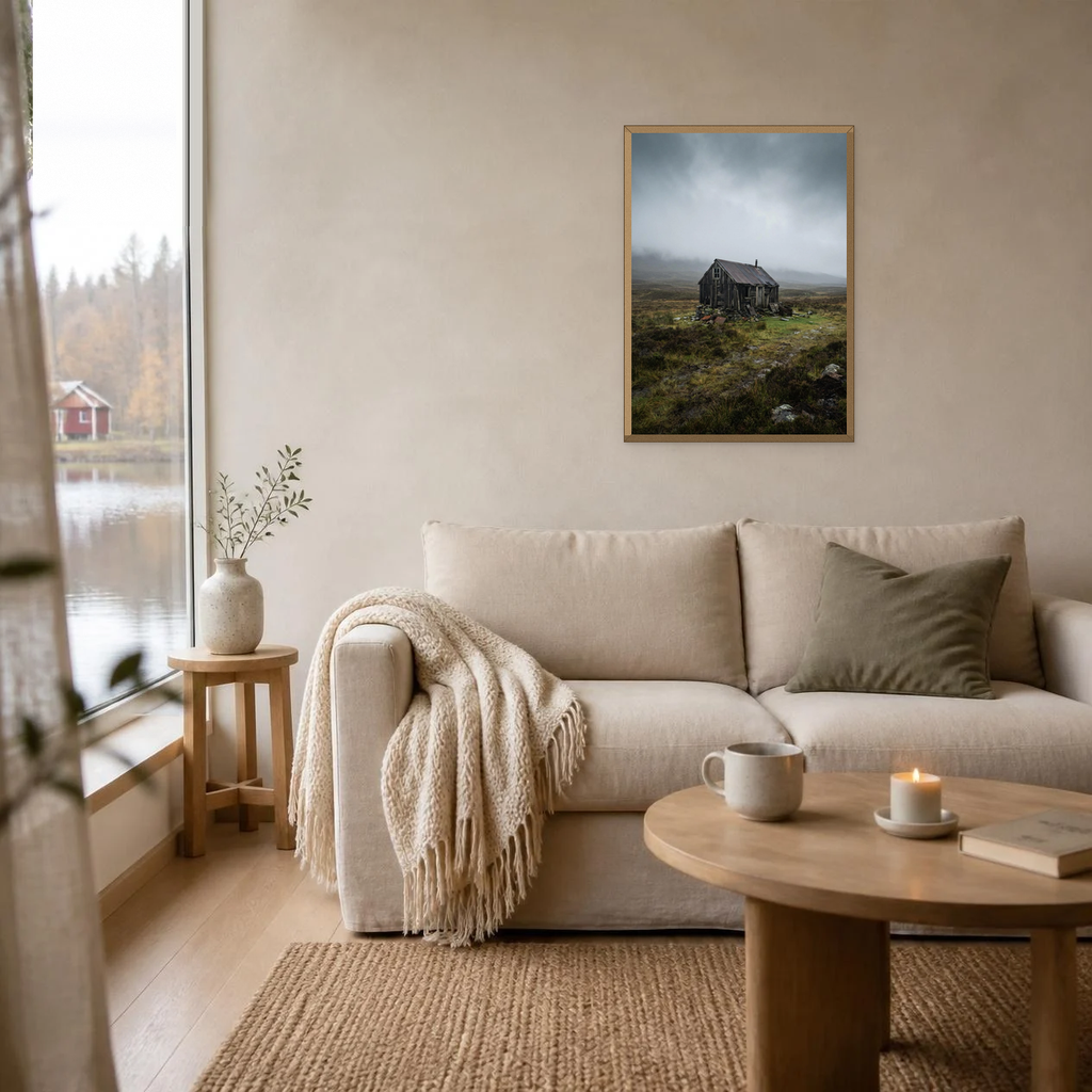 The Moorland Hut poster in a light oak frame above a linen sofa