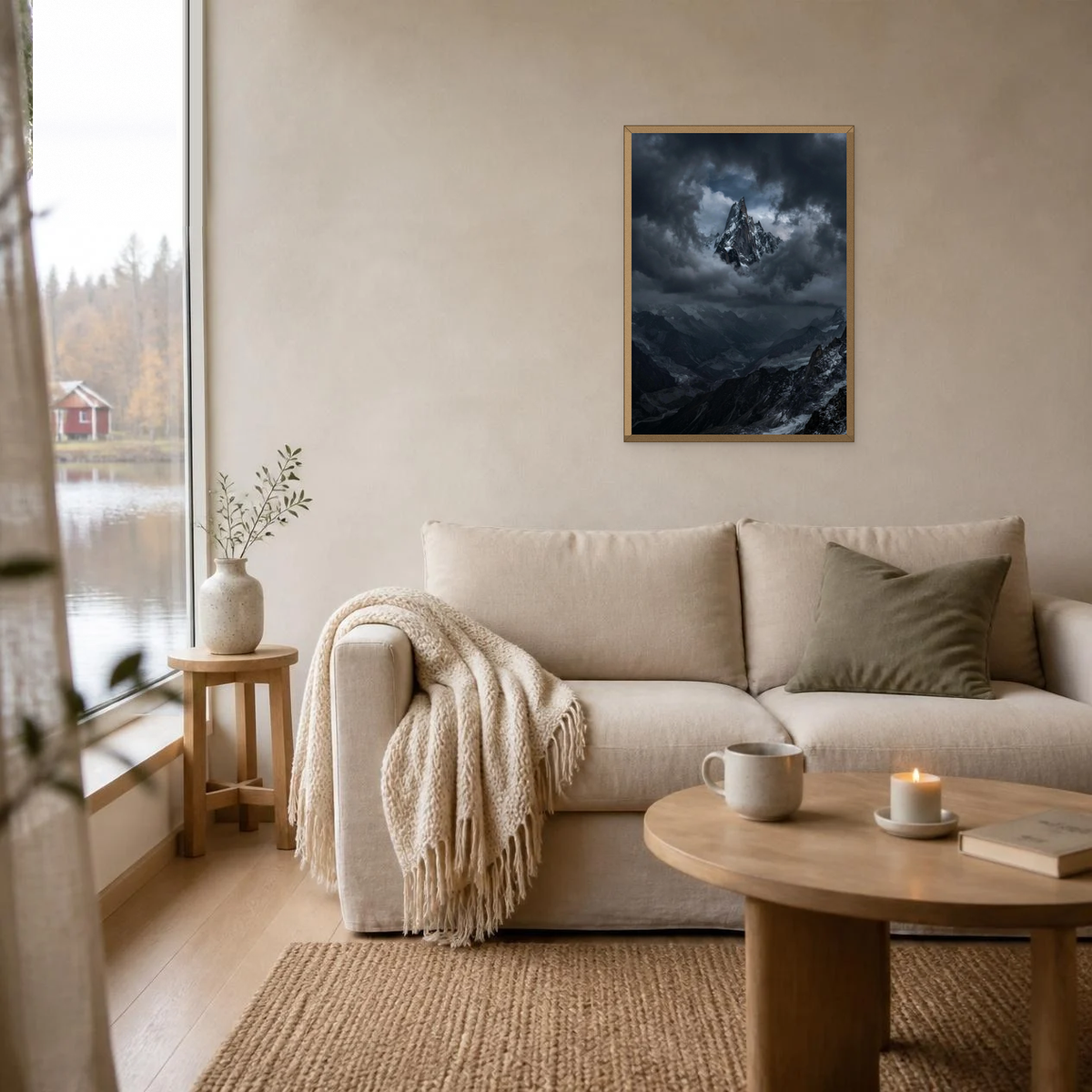 Peak Above the Clouds poster in a light oak frame above a linen sofa