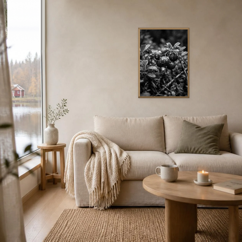 Berries in Black and White poster in a light oak frame above a linen sofa