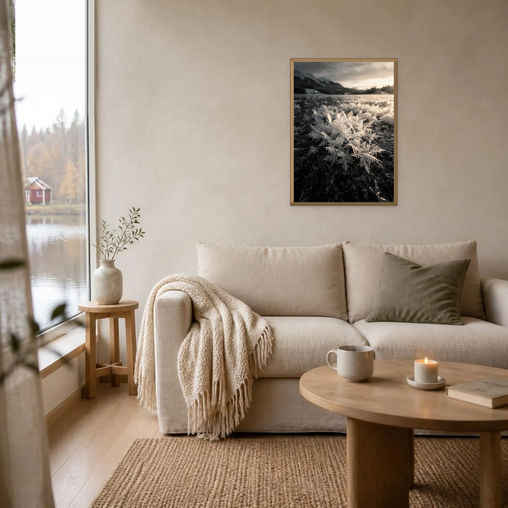 Frost Flowers at Sunrise poster in a light oak frame above a linen sofa