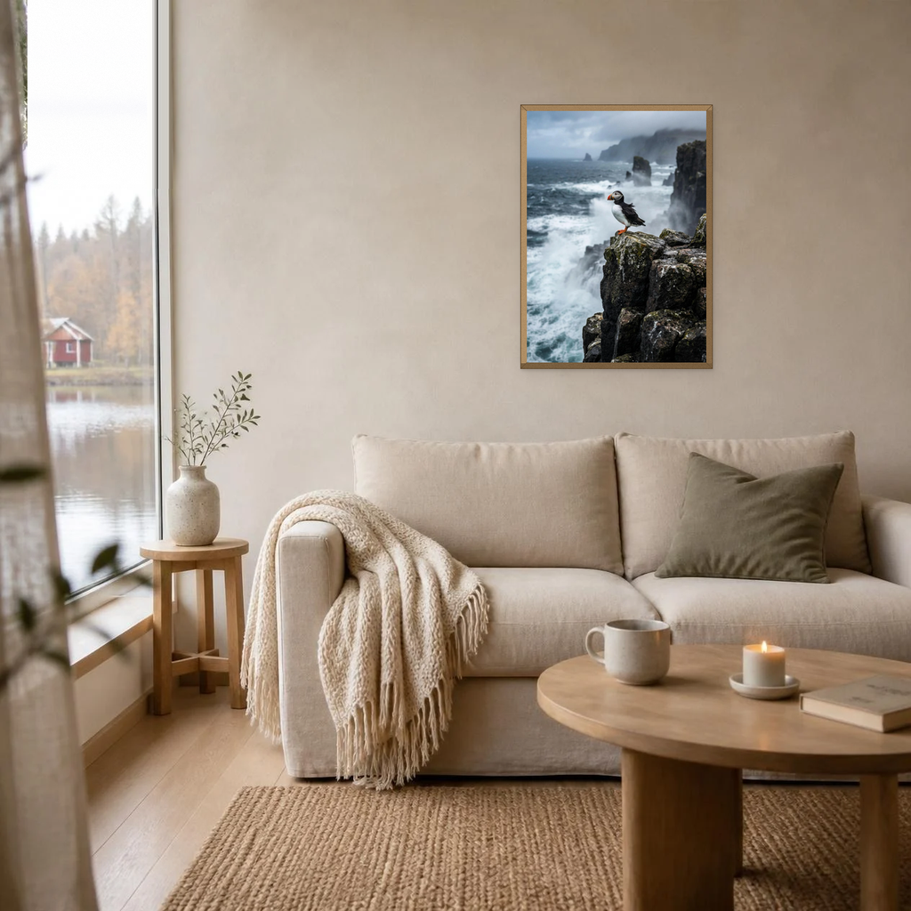 Puffin on the Sea Stack poster in a light oak frame above a linen sofa