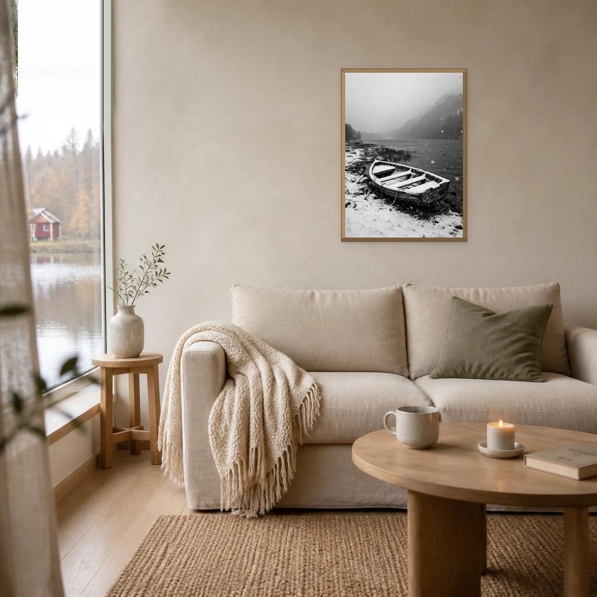 Snow on the Old Rowing Boat poster in a light oak frame above a linen sofa