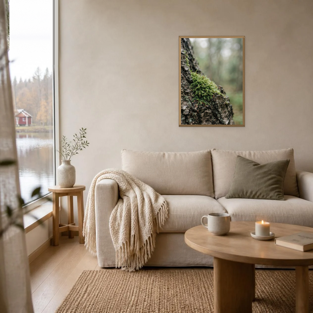 Moss and Bark poster in a light oak frame above a linen sofa