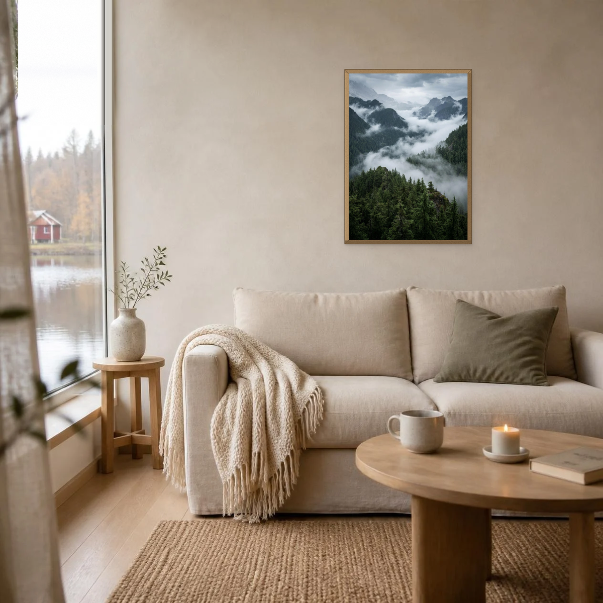 Fog Through the Pine Valley poster in a light oak frame above a linen sofa