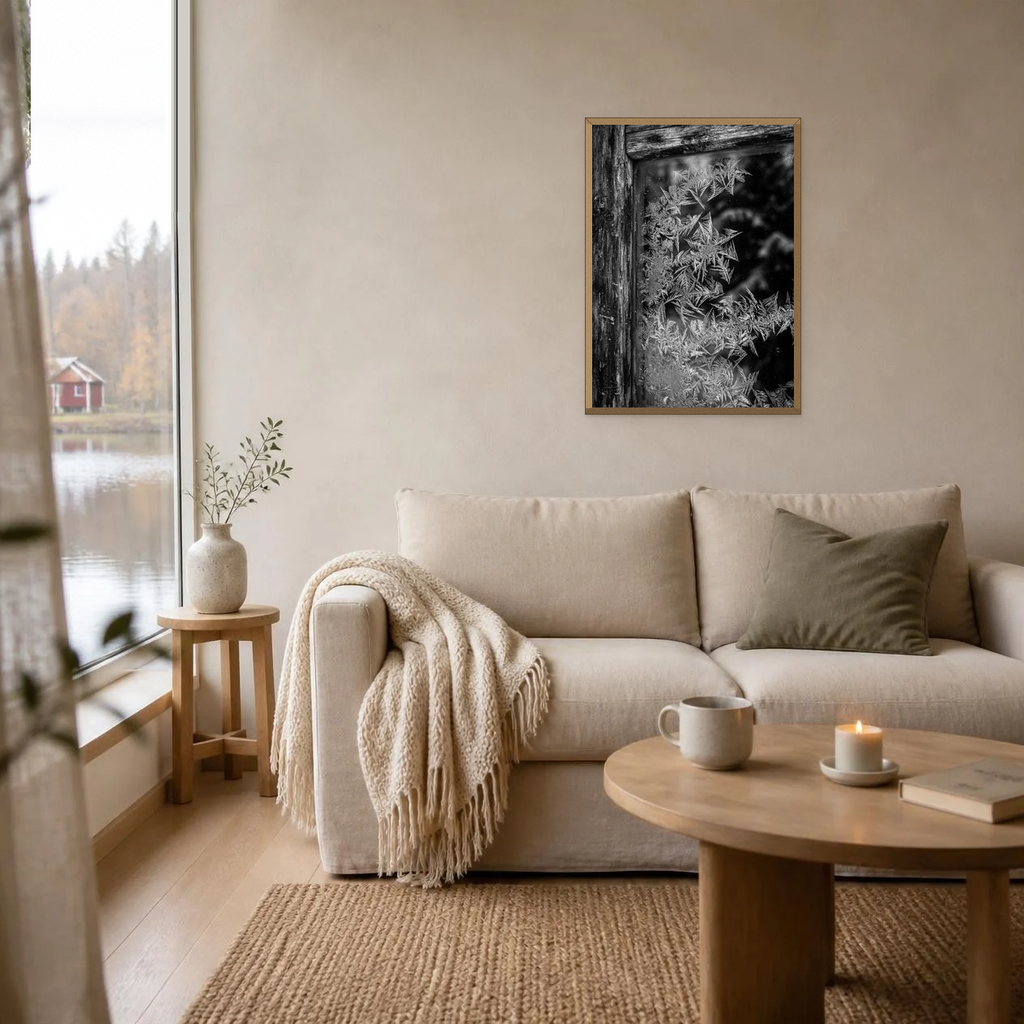 Frost on the Windowpane poster in a light oak frame above a linen sofa