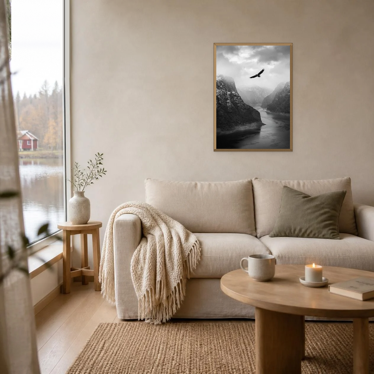 Sea Eagle Over the Fjord poster in a light oak frame above a linen sofa