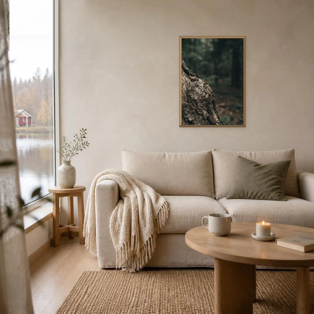 The Language of Bark poster in a light oak frame above a linen sofa